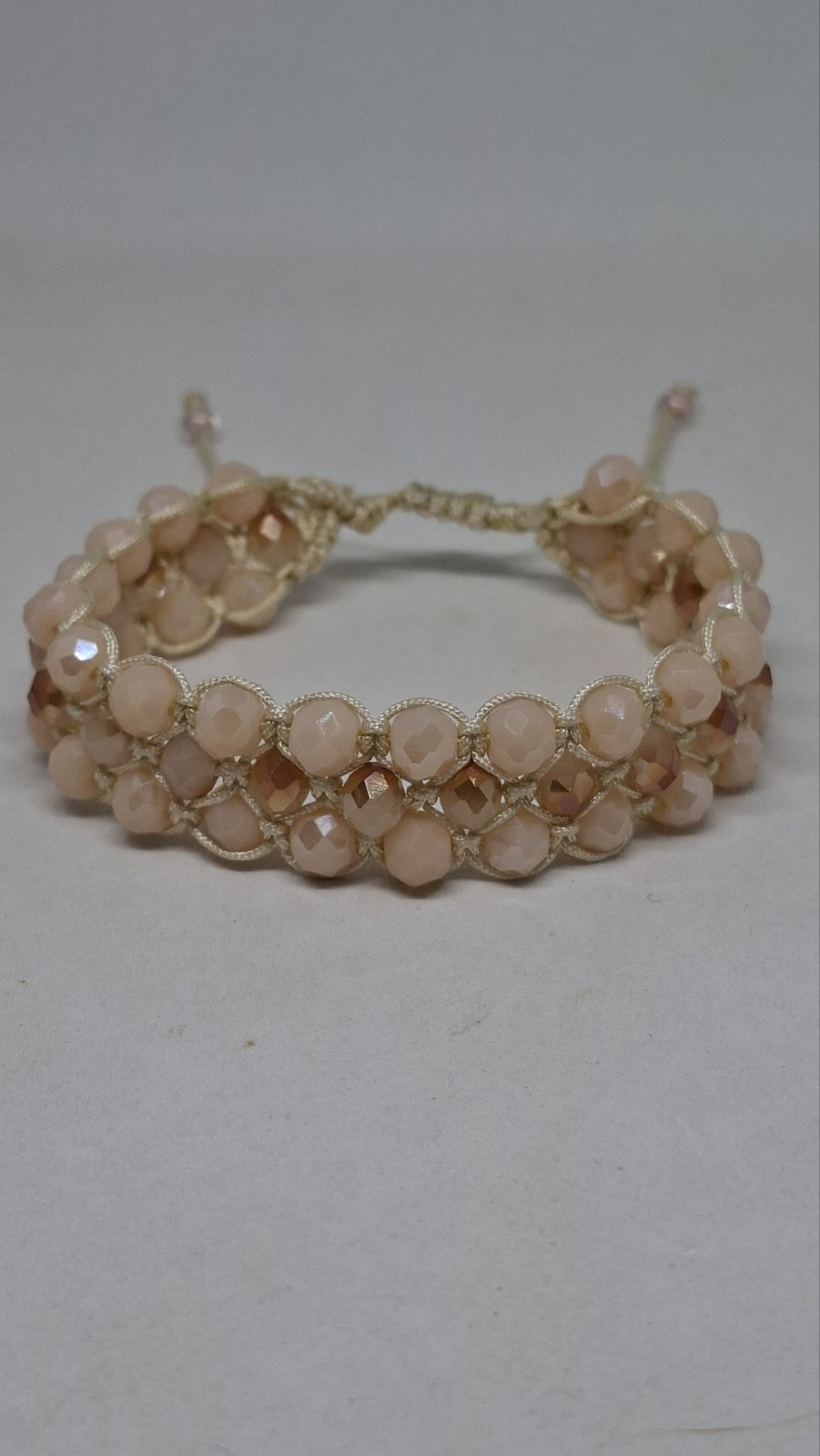 Detail of handmade macramé bracelet texture with beige beads – Georgia Create Cyprus