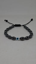 Hematite evil eye bracelet on a white background