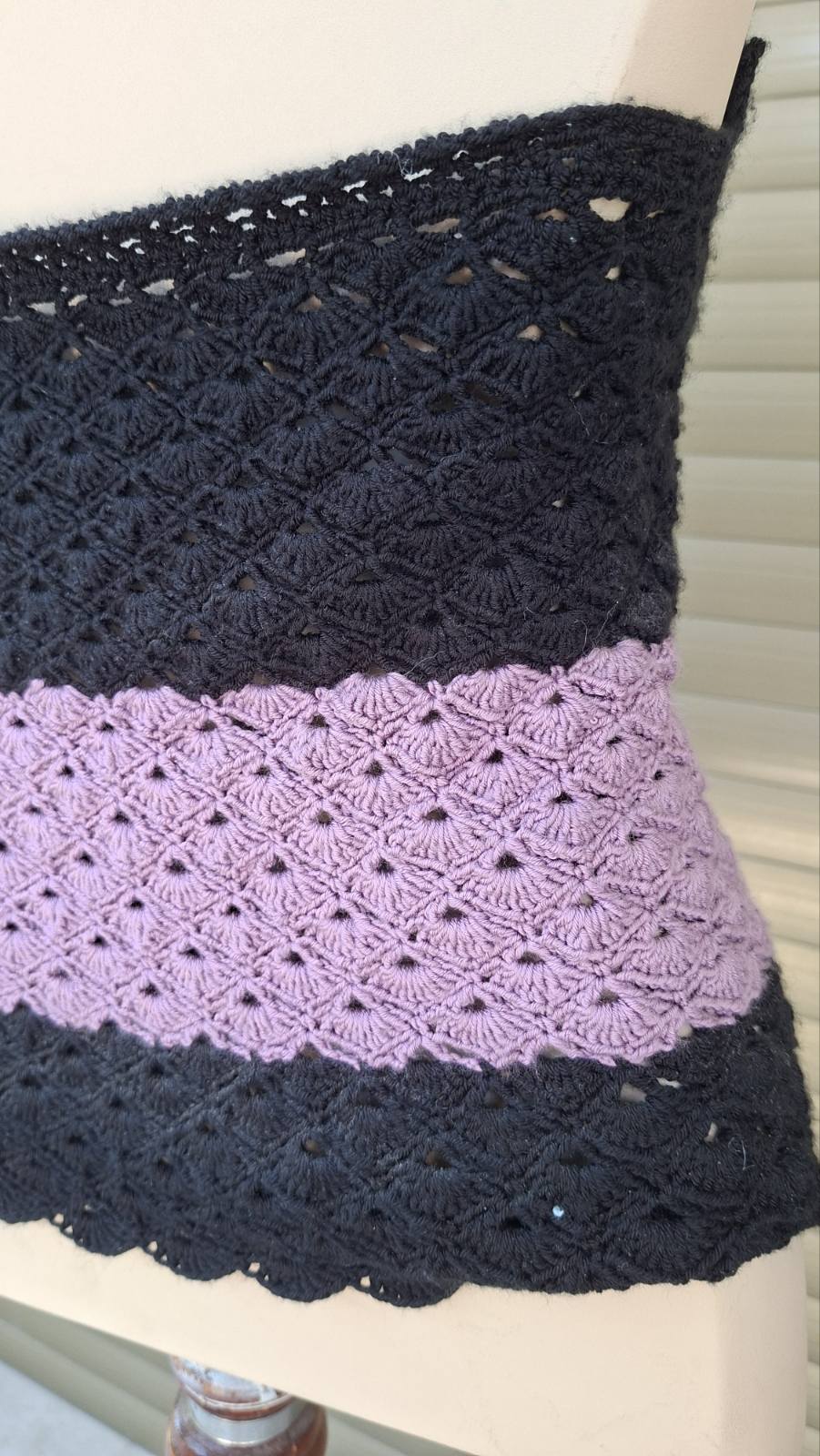 Close-up of handmade crochet swimsuit top in purple and black – Georgia Create